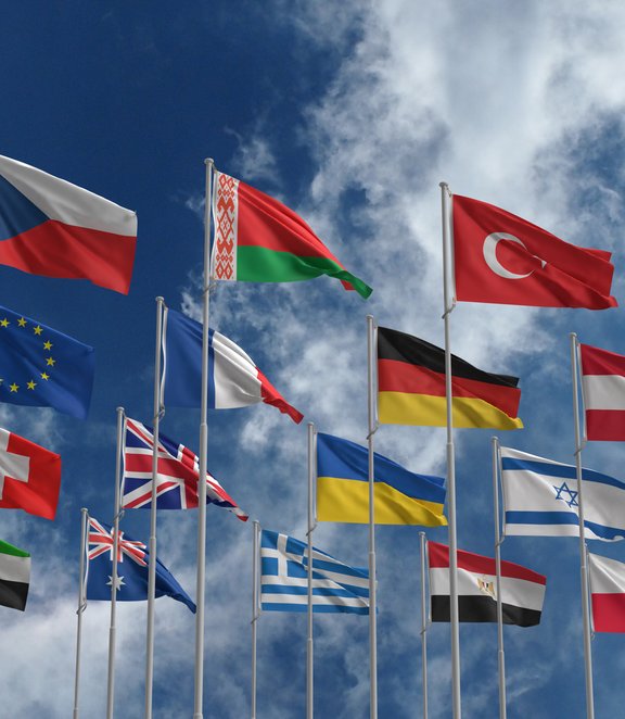 Flags with cloud in background